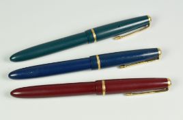 THREE VINTAGE PARKER SLIMFOLD FOUNTAIN PENS each with an original 14ct gold nib (blue, green & red)