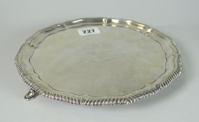 EDWARD VII SILVER CIRCULAR SALVER having pie crust edge raised on three hoof feet. Engraved with