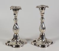 PAIR OF NORWEGIAN SILVER (LOADED) CANDLESTICKS, of spiral form with repousse scroll decoration. (