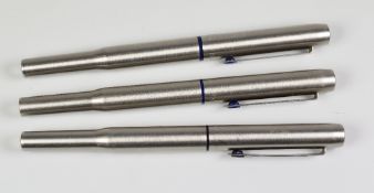 THREE VINTAGE STAINLESS STEEL PARKER 25 ROLLERBALL PENS with blue trim