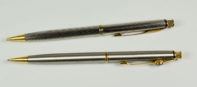 TWO MODERN PARKER INSIGNIA PENCILS push button actuated, one stainless steel with Dimonite G gold