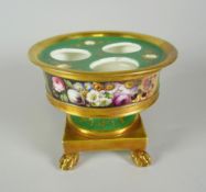 A NINETEENTH CENTURY PORCELAIN INKSTAND in green ground with gilding and of pedestal form with