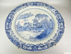 LARGE CHINESE PORCELAIN BLUE & WHITE WALL CHARGER depicting pagoda within river landscape having