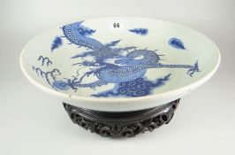 CHINESE PORCELAIN BLUE & WHITE PEDESTAL BOWL depicting four claw dragon chasing flaming pearl within