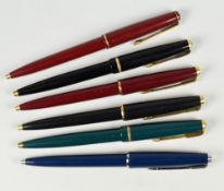 THREE PARKER 17 BALLPOINT PENS one black, one green, one red - all with gold plated trim together