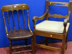 An antique oak farmhouse armchair & a spindle back example with double stretchers
