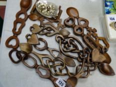A large quantity of Celtic and other wooden love spoons