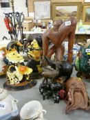 A pair of cast iron Punch & Judy doorstops, a carved Oriental mask & other treen