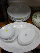 A parcel of plain white dinnerware including meat platter