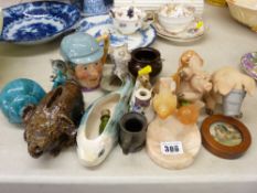 A selection of ornamental figurines, a serpentine stone cauldron, an alabaster bird pin tray etc
