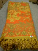 A patterned heavy throw with tasselled ends