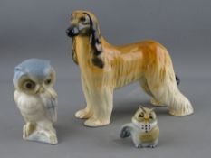 A Beswick model of an Afghan hound, a European porcelain model of an owl & a Wade/Disney example