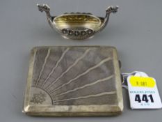 A hallmarked silver cigarette case & a white metal model of a Viking boat with glass liner