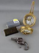 A vintage revolver pocket pistol, a boxed quantity of .22 spent casings & a reproduction brass