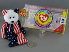 A cased Ty beanie baby, '1999 Spangle'