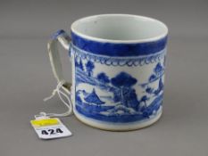 An early 19th century Chinese export blue & white decorated mug