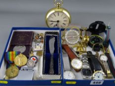 A mixed group of collectables including wristwatches, WWI medals, golly & other badges etc
