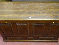 An antique pine panel fronted blanket chest of peg joined construction