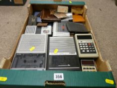A selection of vintage cassette recorders, electronic calculators, leather wallets etc
