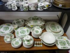 A very large quantity of Masons Fruit Basket green and white coloured dinnerware