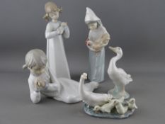 A group of Lladro & Nao porcelain figurines