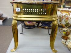 A Victorian brass & iron footman