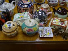 A parcel of novelty and other teapots, cheese dishes etc