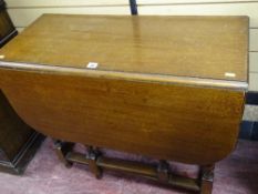 An oak barley-twist gate leg table