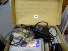 An SNES Super Nintendo console & games E/T