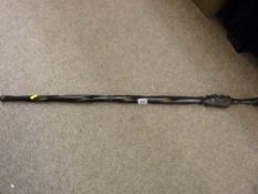 A carved African ebony open twist walking cane