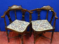 A pair of Edwardian inlaid mahogany corner chairs