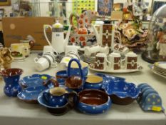 A collection of blue polka dot Torquay & Devon ware