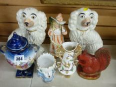 A pair of Staffordshire comforter dogs, a swan pedestal egg cup, figures & vases