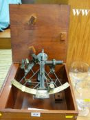 A sextant (marks unclear) in a wooden box