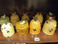 A parcel of lidded honey pots etc