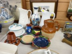 Three relief pottery jugs, a collection of Langley-style colourful pottery, a Corona ware vase etc
