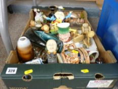 A Poole dolphin, a cast iron Humpty Dumpty money box, an assortment of figural ornaments etc