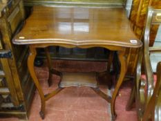 Shaped top occasional table with undershelf on bentwood legs