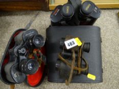 Three sets of cased vintage field binoculars