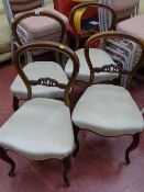 Four matching upholstered antique style balloon back chairs