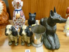 Plated novelty tankard with golf ball handle, bronzed reclining dog figure initialled 'T H Cartier',