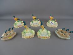 Pair of Beswick mallard pin dishes and five Beswick mallard and pheasant ashtrays