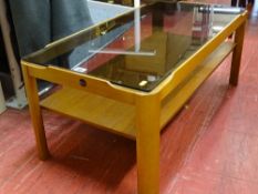 Small coffee table with smoky glass top and undershelf, by Myer
