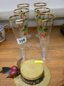 Six Cherry B glass flutes and a Cherry B advertising boater