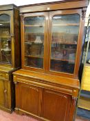 Antique bookcase cupboard with twin glazed upper doors, central drawer and two base cupboards