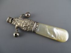 A Silver and mother of pearl baby's rattle