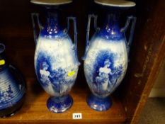 Pair of blue and white twin handled Staffs vases