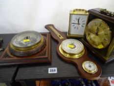 A reproduction balloon barometer, table top barometer, carriages clock and a mantle clock