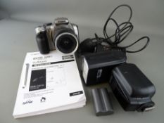 Canon EOS camera with Neewer attachable flash, charger and battery