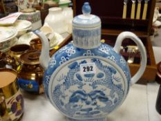 Pedestal blue and white Oriental moon jug